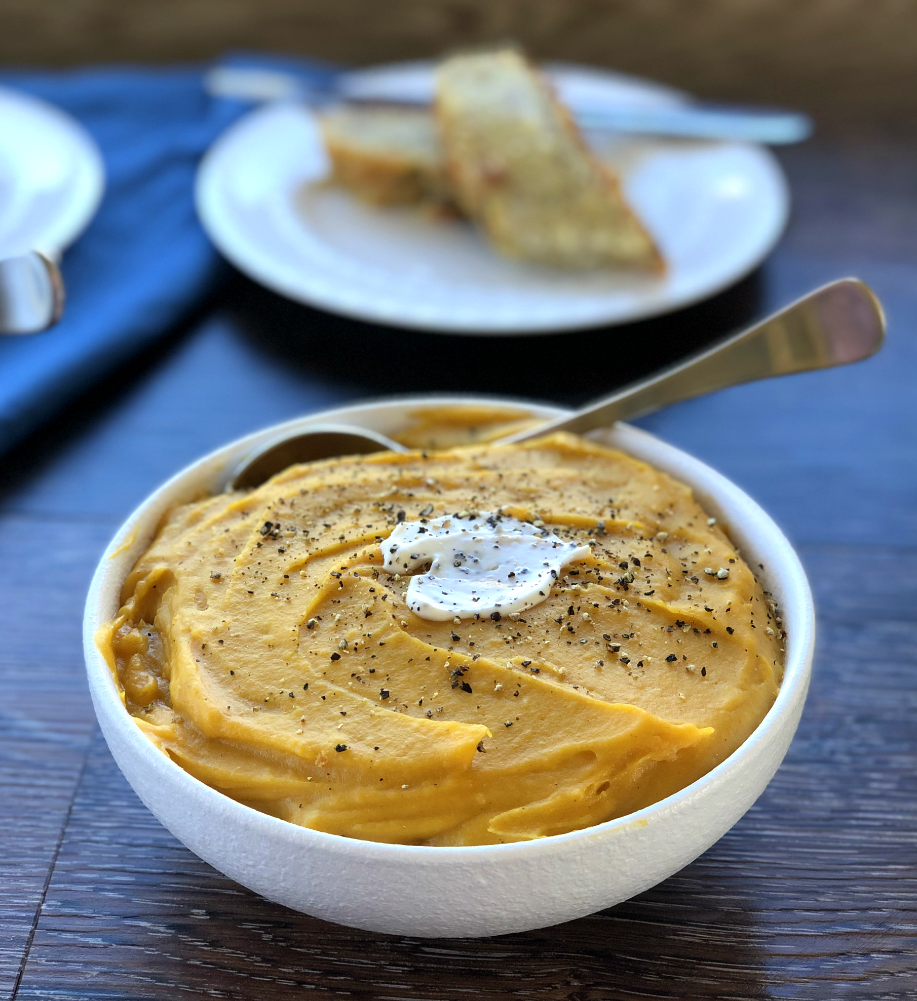 Bowl of Warm Pumpkin Soup with Cream 