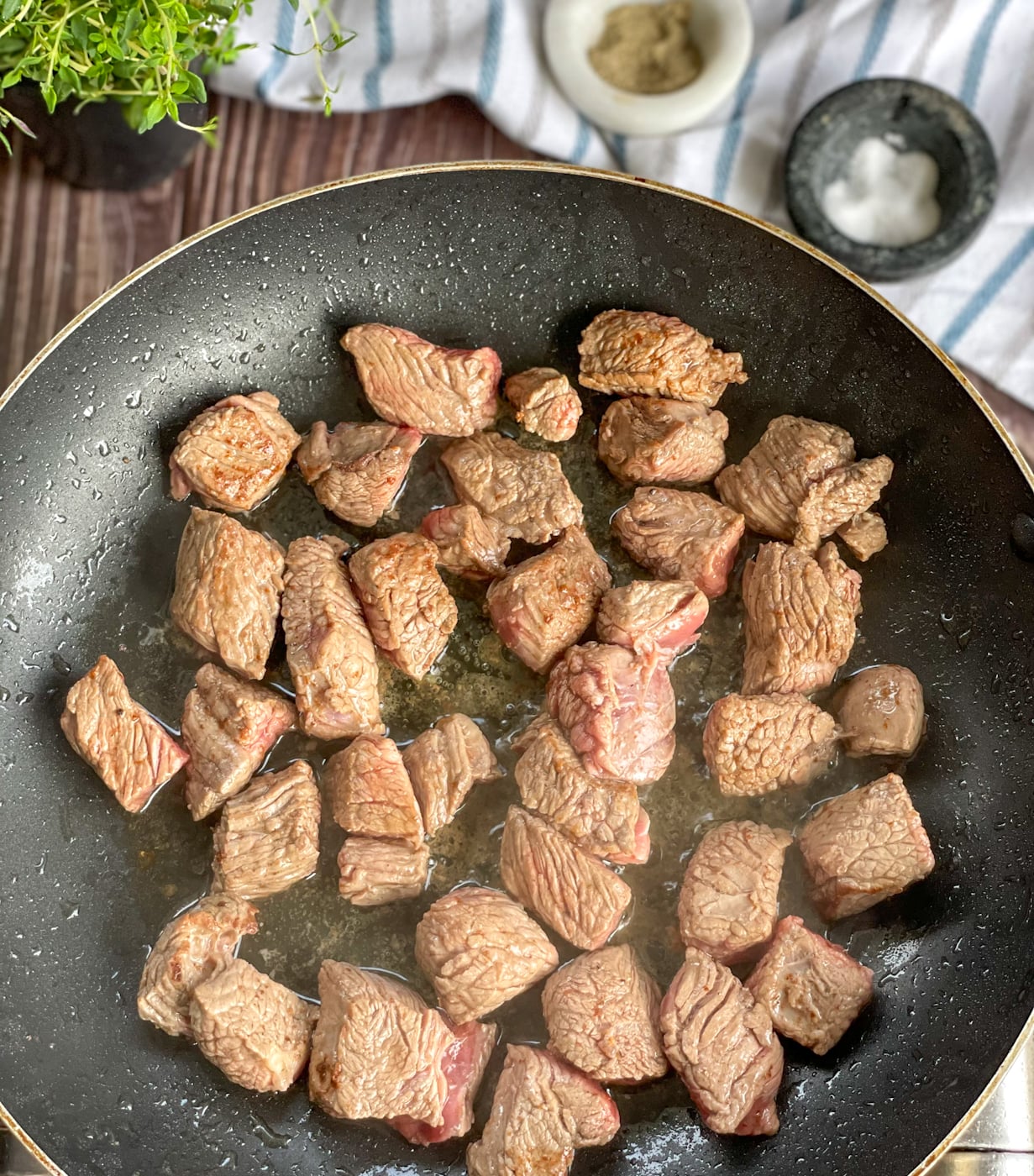 Browning beef before adding it to the slow cooker