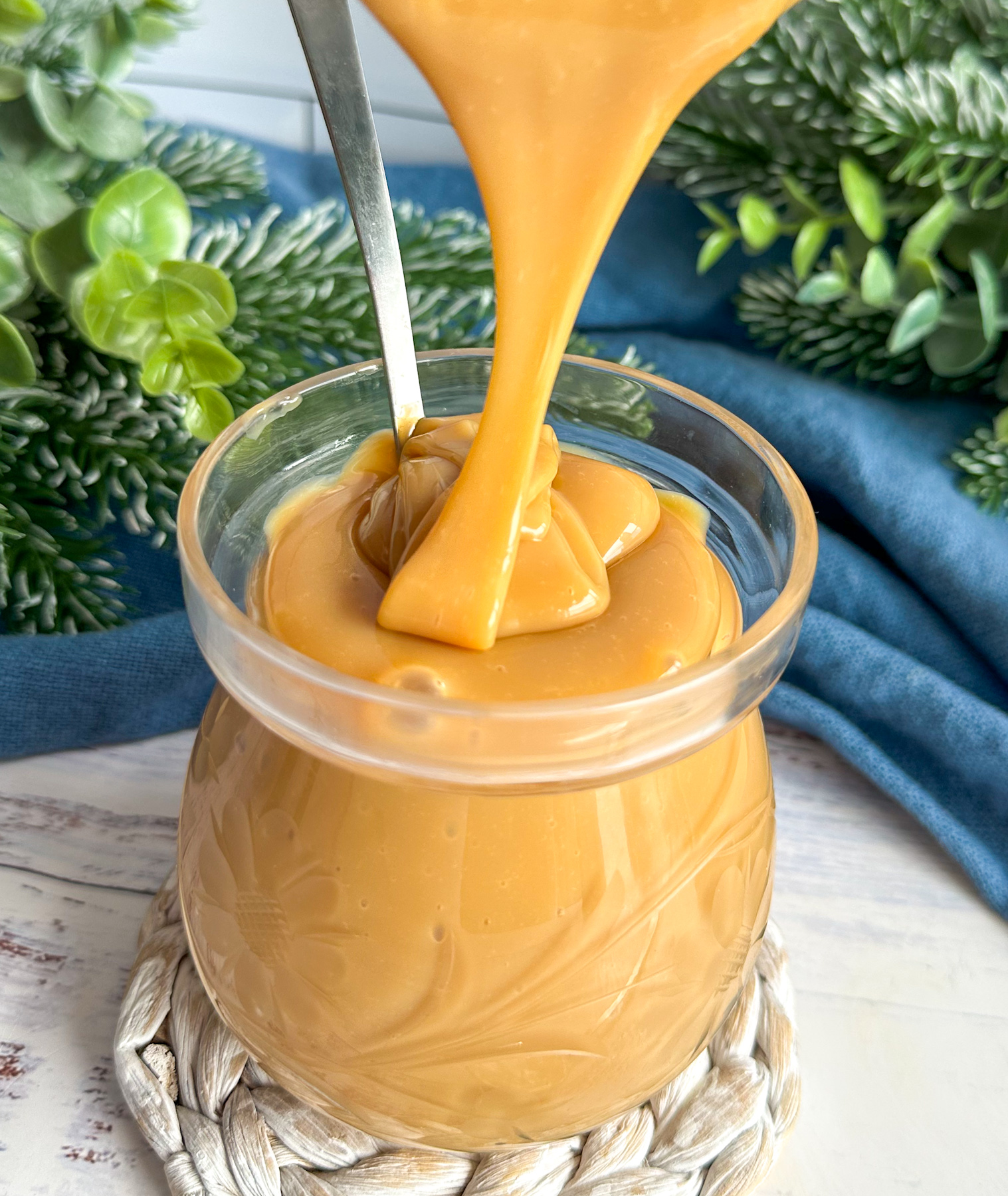 Homemade Dulce Le Leche drizzled into a glass jar