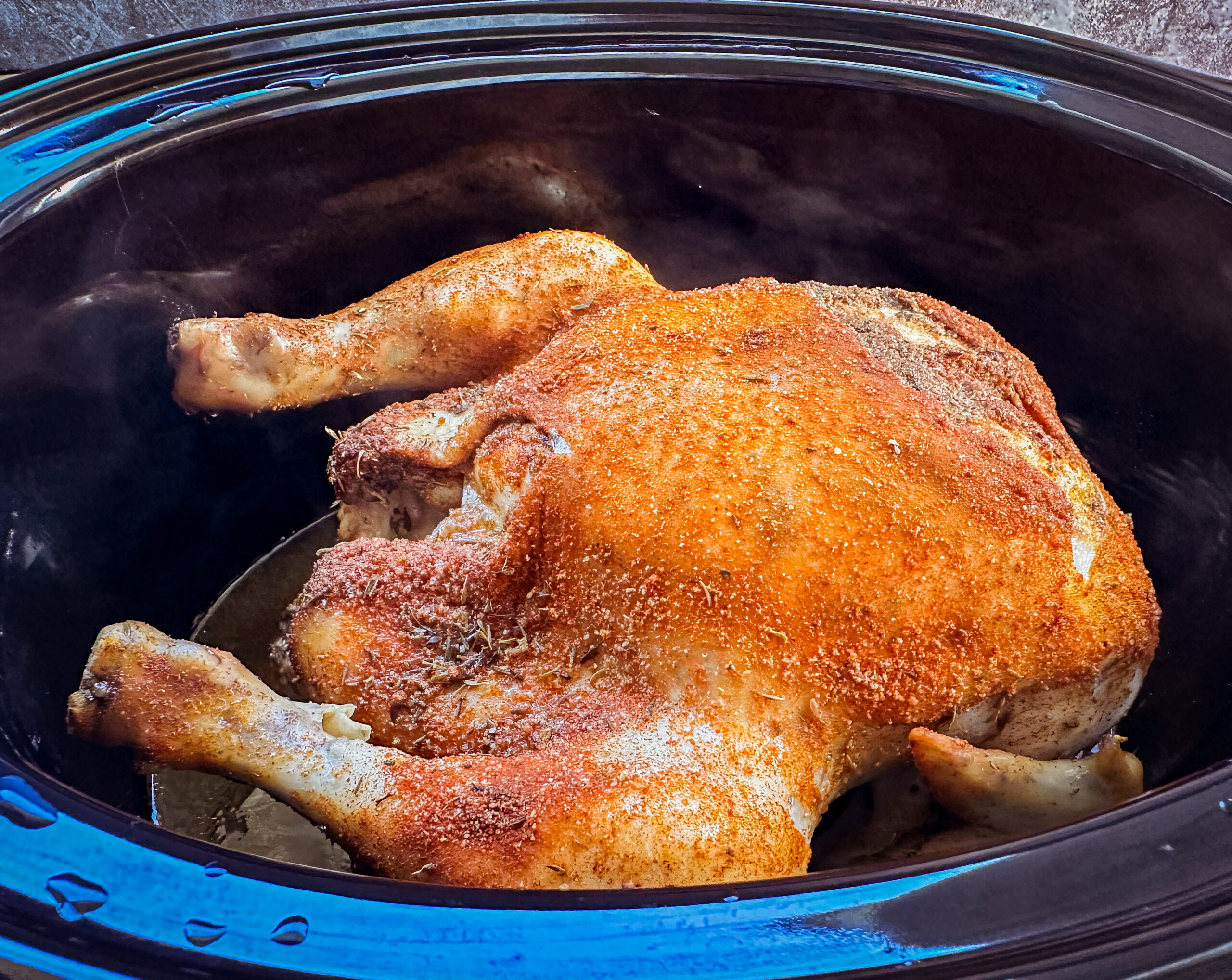 Whole chicken cooked in a slow cooker