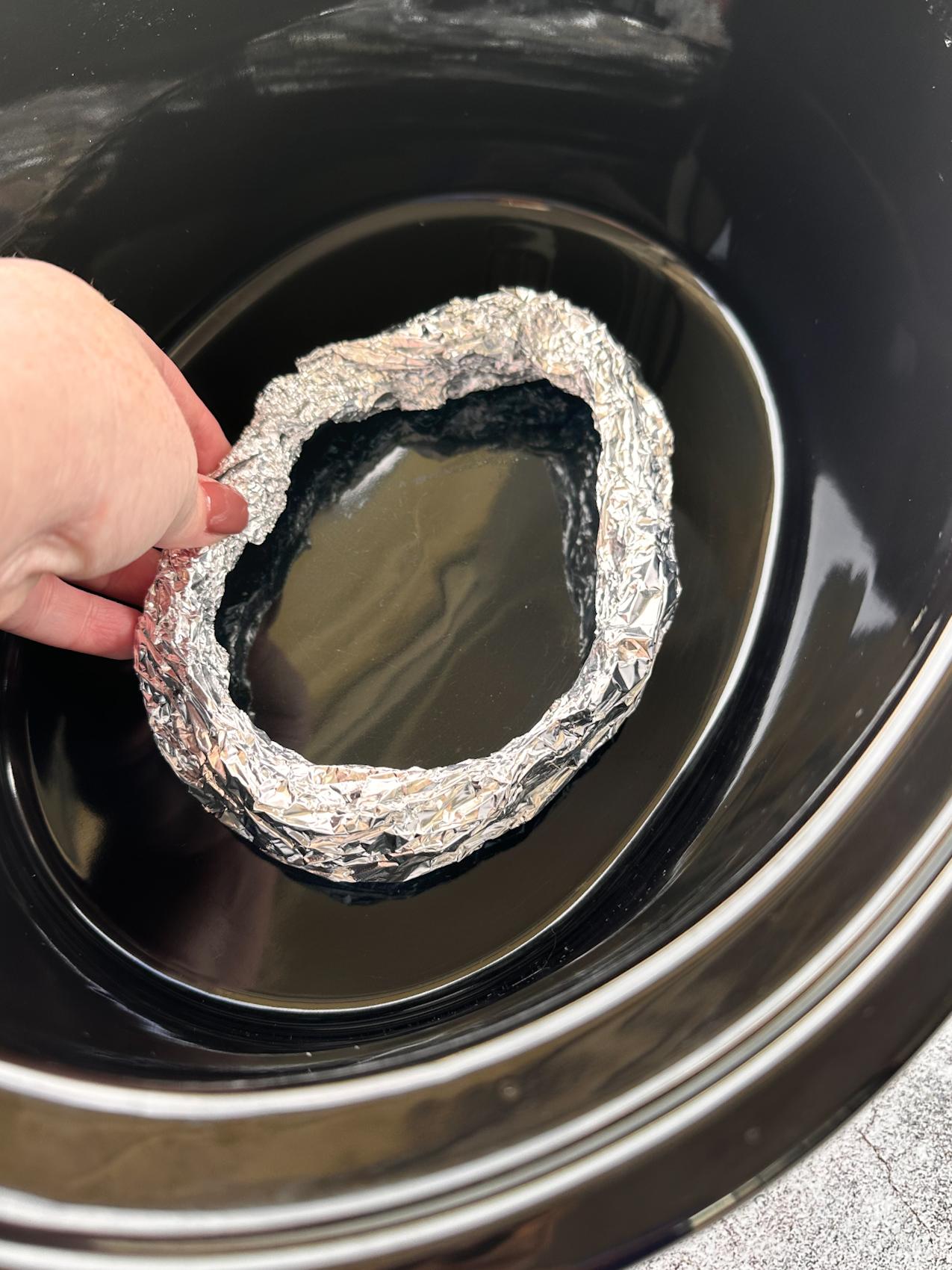How to make a ring of aluminum foil to elevate chicken off bottom of slow cooker