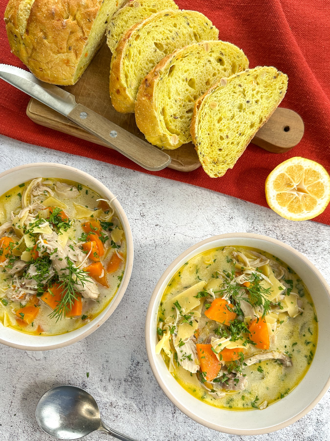 Cozy Creamy Slow Cooker Chicken Noodle Soup Creamy crockpot chicken noodle soup in bowls served with crusty bread