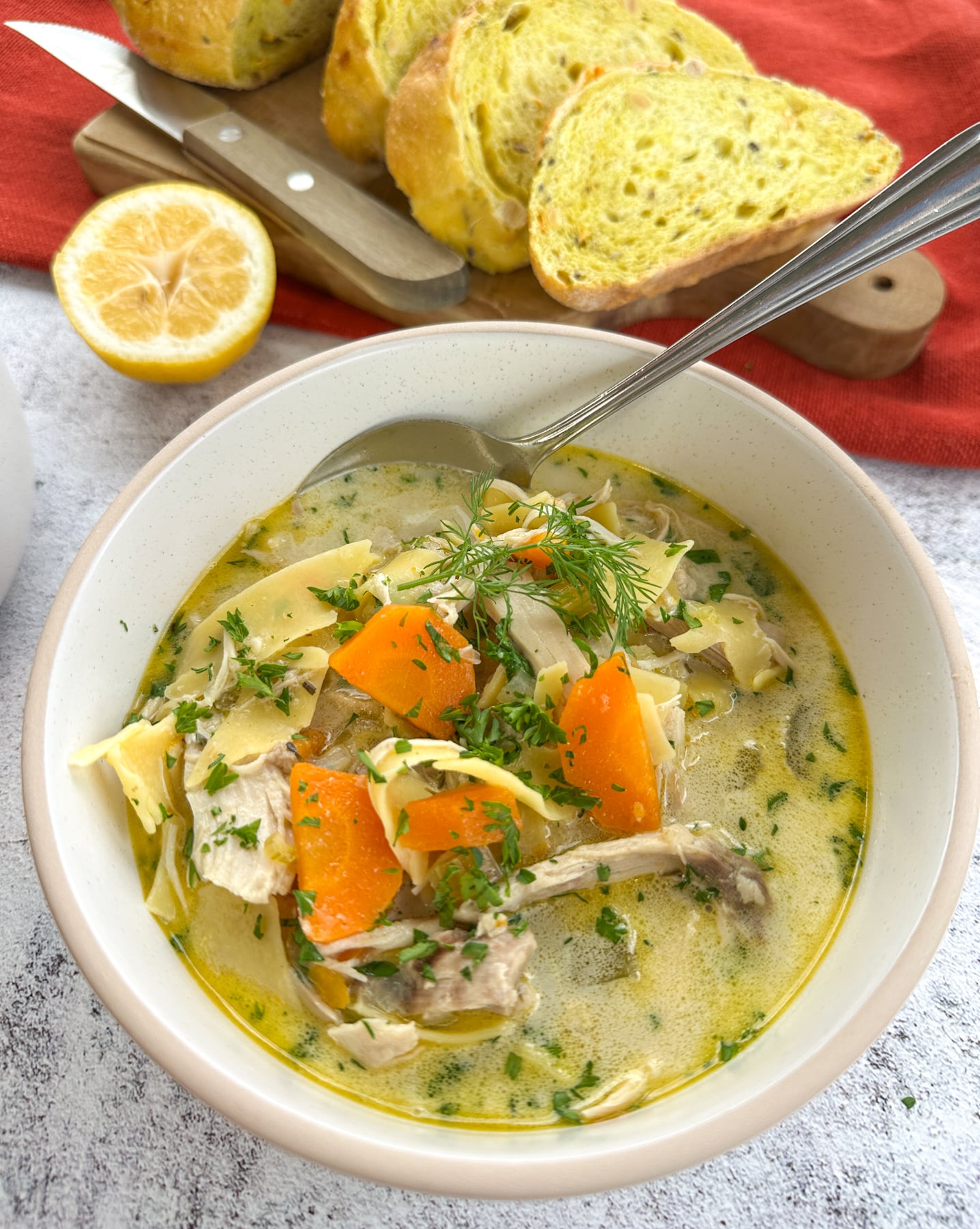 Easy Slow cooker Chicken noodle soup Pinterest pin Bowl of creamy slow cooker chicken noodle soup garnished with fresh parsley