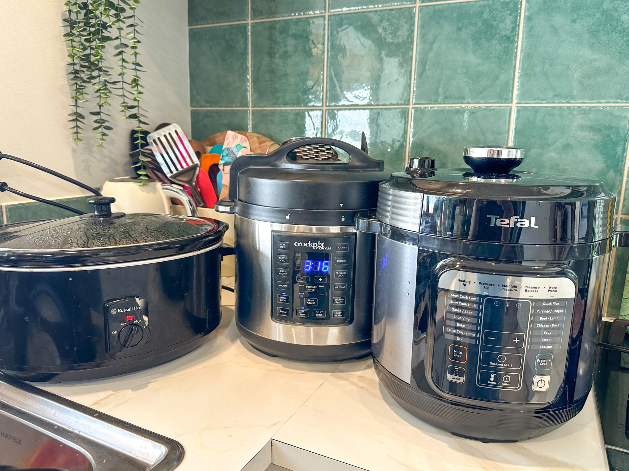 three different slow cookers and multi cookers