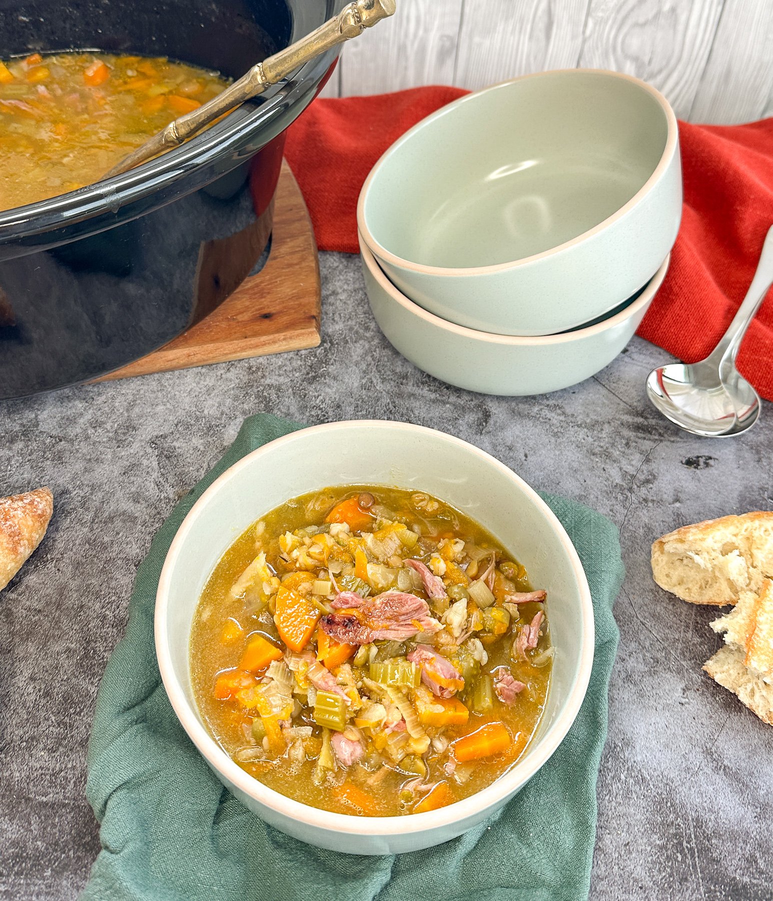 bowl of ham hock and vegetable split pea soup and the slow cooker
