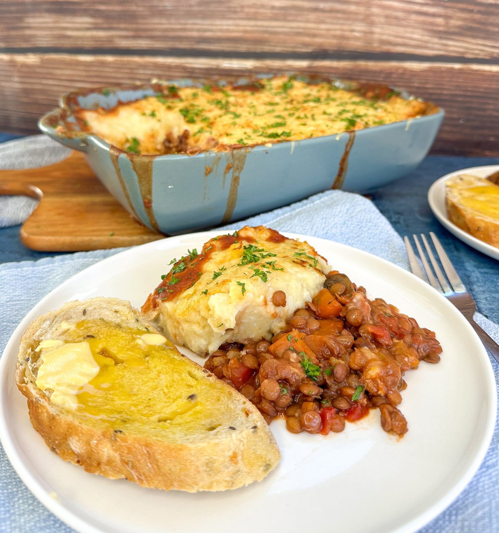 plate full of comforting lentil and vegetable crockpot cottage pie