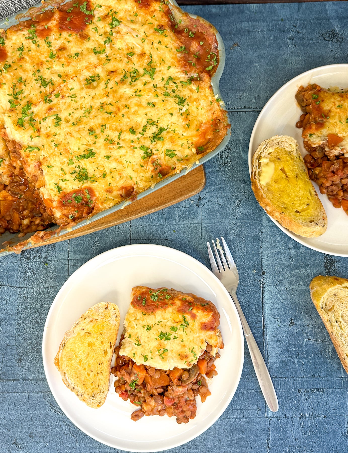 plates full of crockpot lentil and vegetable cottage pie
