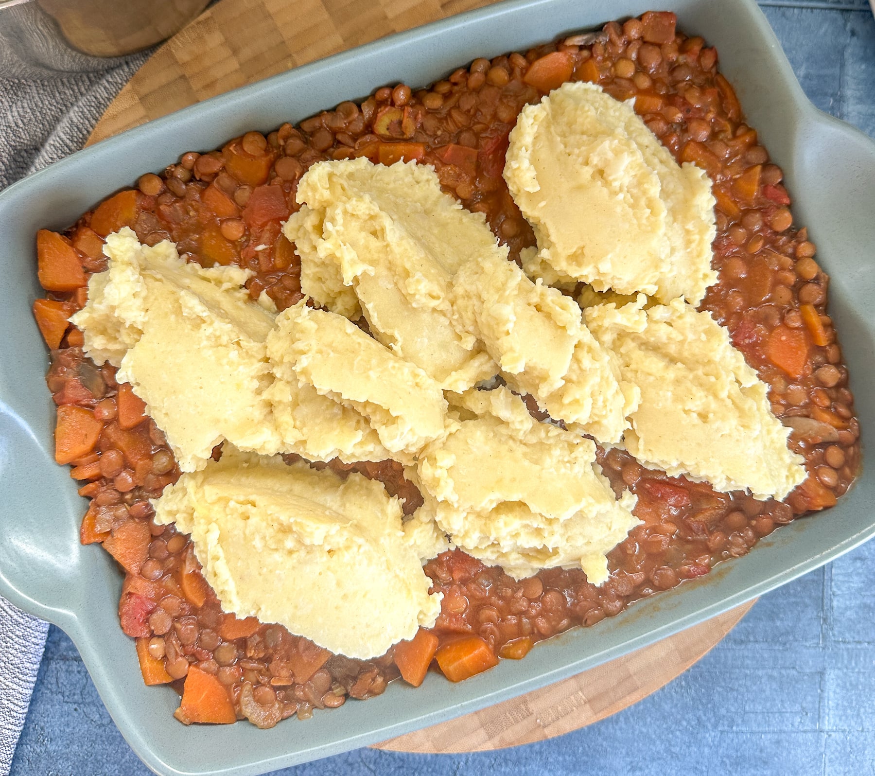 cauliflower and potato mash on top of lentil and vegetable filling