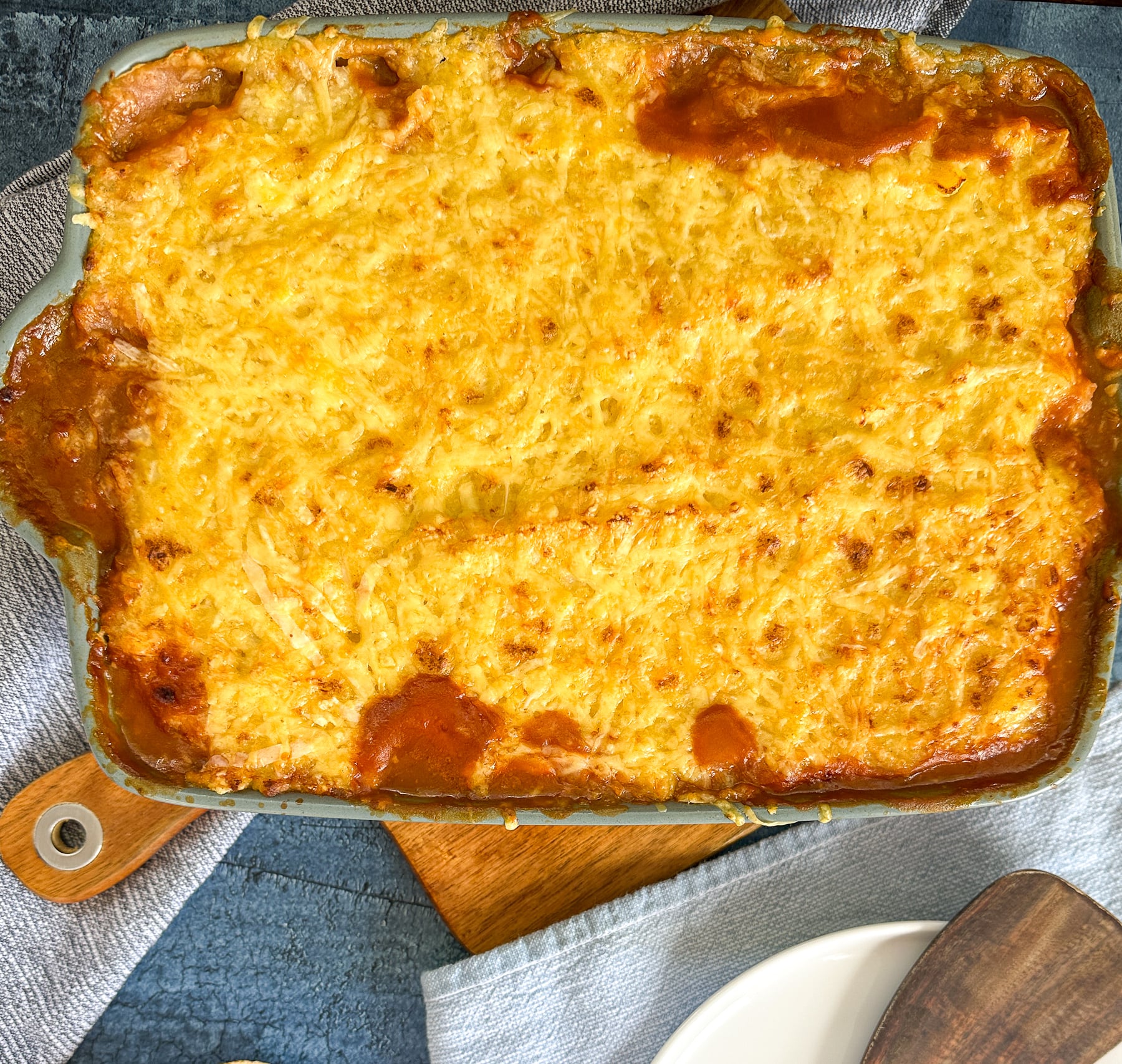 golden brown cheese topping on top of lentil and vegetable cottage pie