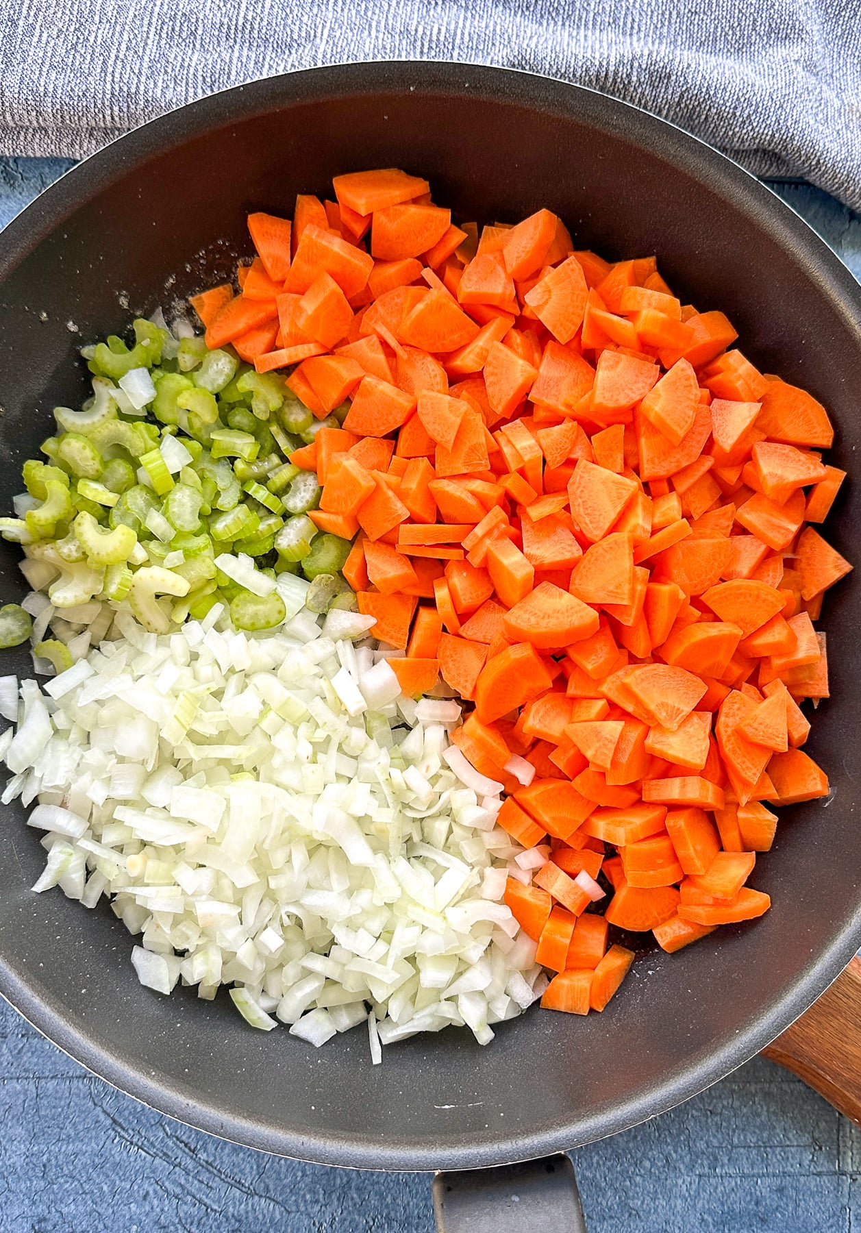carrots celery and onion in the skillet in thirds