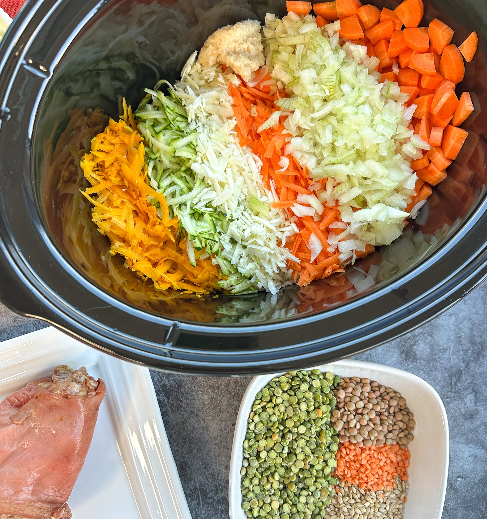 fresh vegetables, bacon hock and lentils as the base of a slow cooker soup