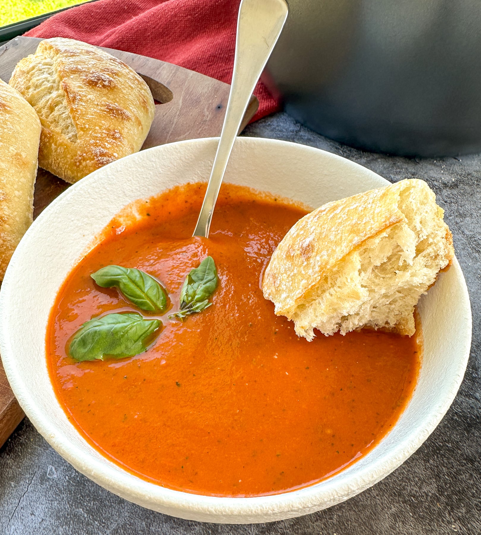 bowl of tomato soup with basil
