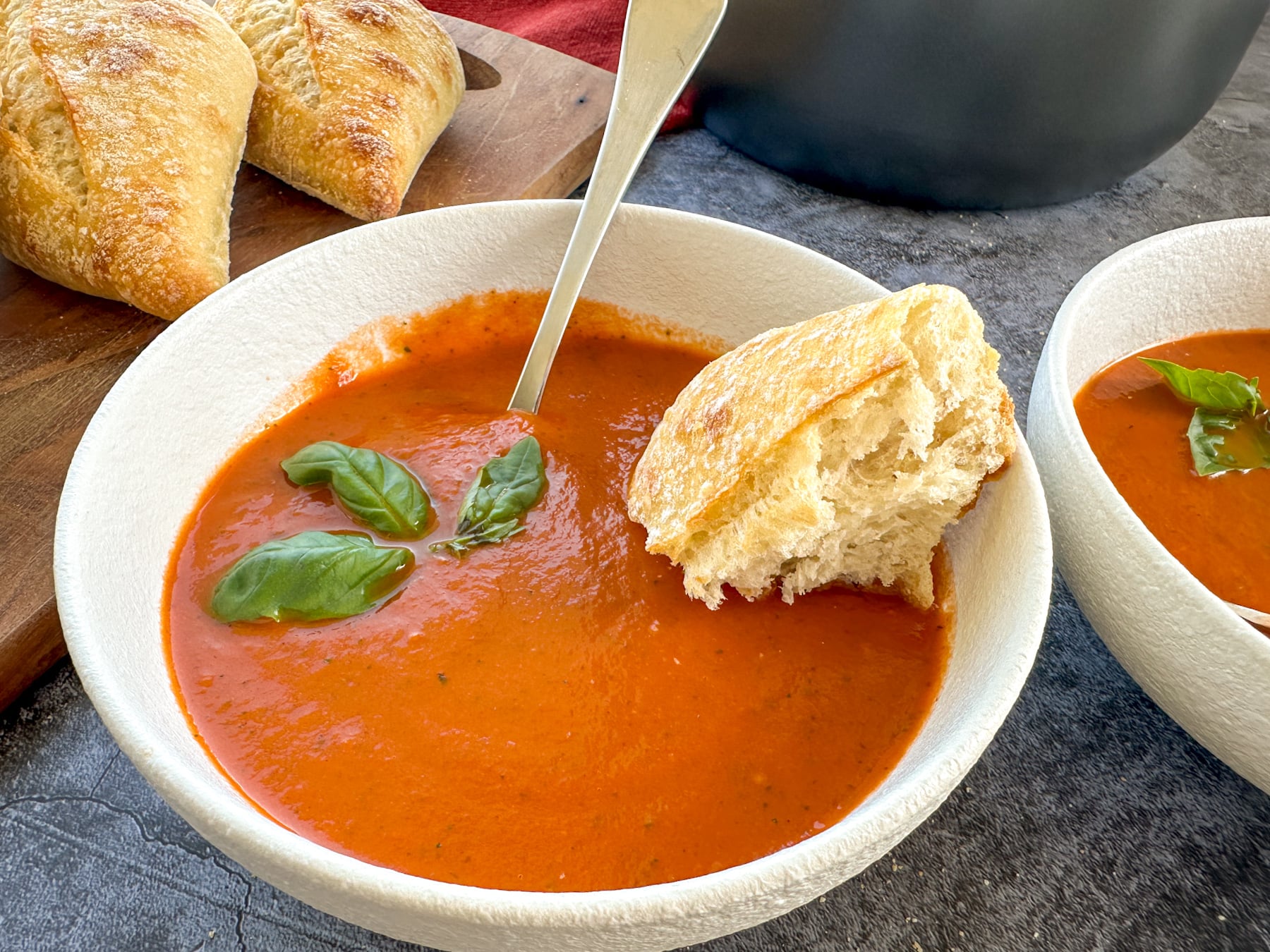 bowl of tomato basil soup with crusty bread