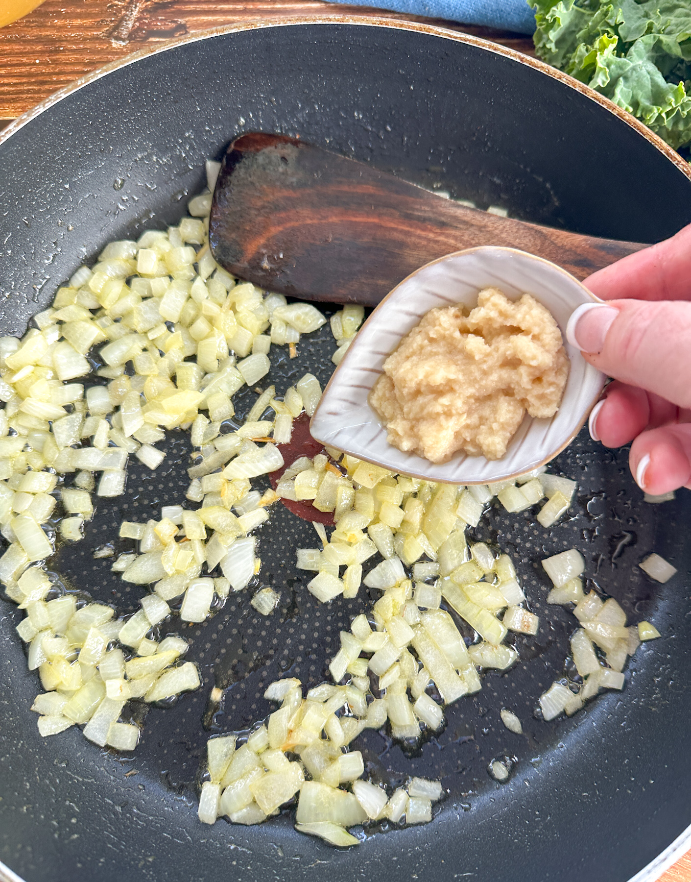 sautéing onion and garlic in a skillet