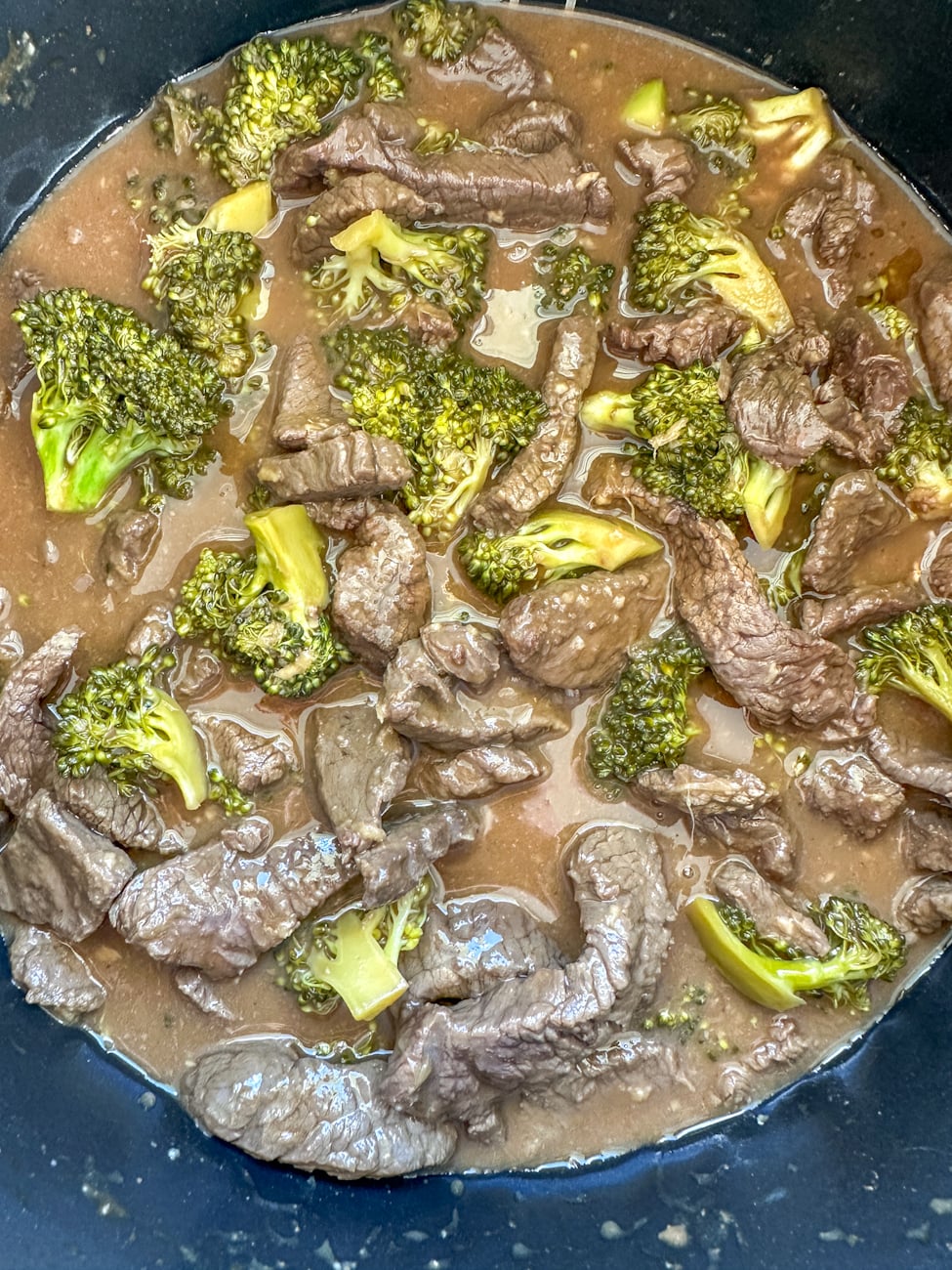 beef and broccoli cooked in the slow cooker with thickened sauce