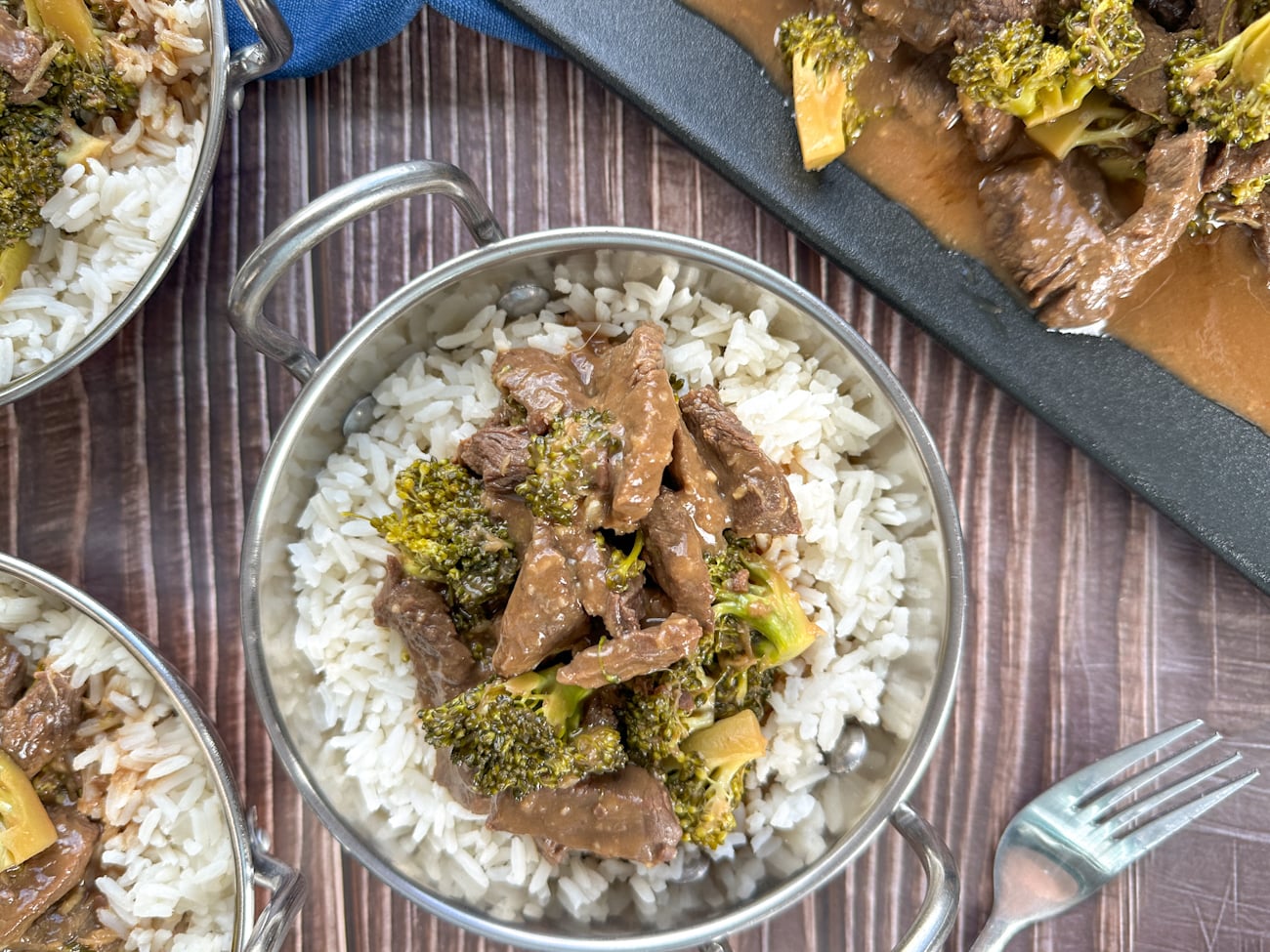 Silver bowl with rice and beef and broccoli