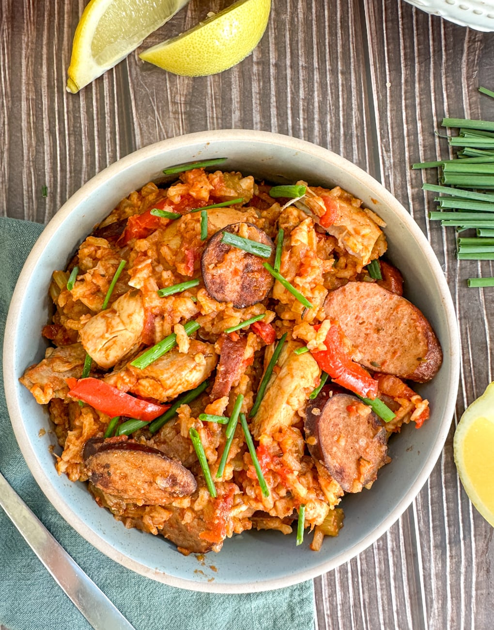 bowl of chcken and sausage jambalaya with rice cooked in the slow cooker