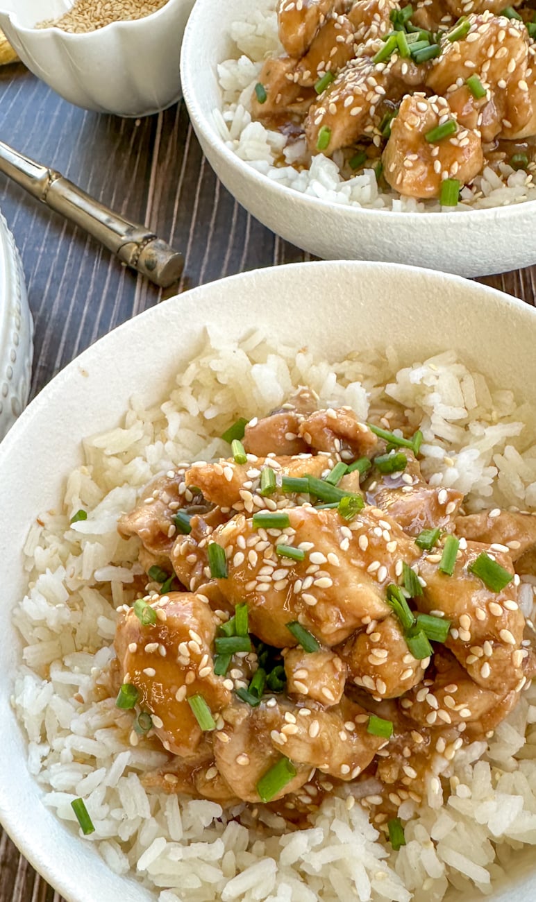 bowl of rice with honey soy chicken on the top