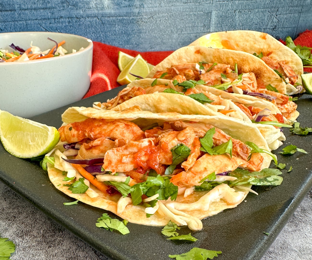 Slow Cooker Mexican Shredded Chicken on soft tacos