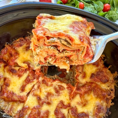 Slice of ricotta and spinach lasagna in the slow cooker