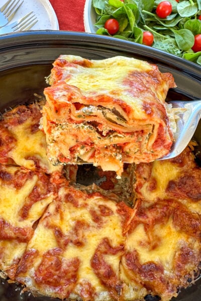Slice of ricotta and spinach lasagna in the slow cooker