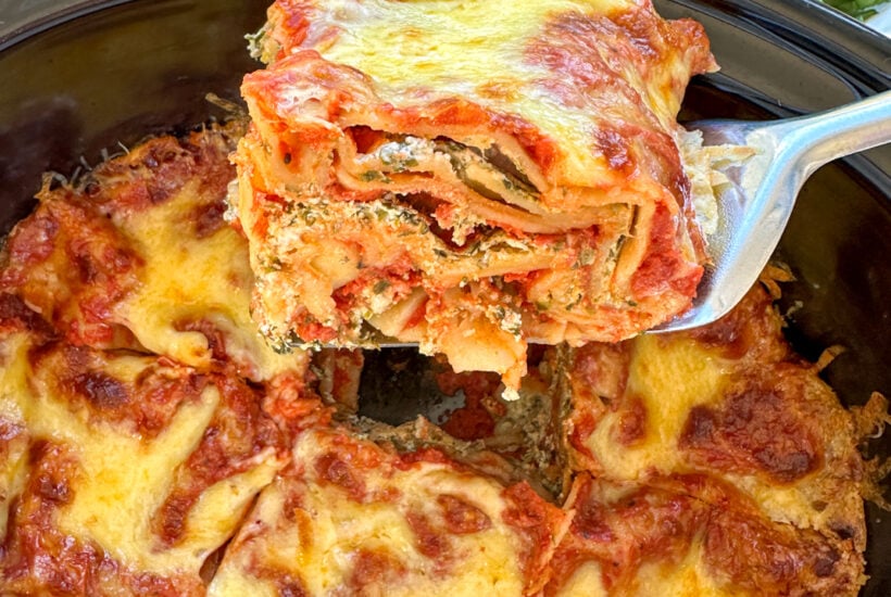 Slice of ricotta and spinach lasagna in the slow cooker