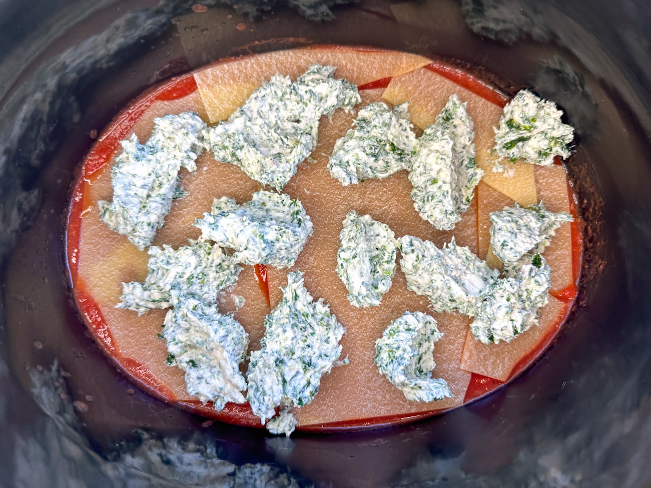 layering the vegetarian lasagna