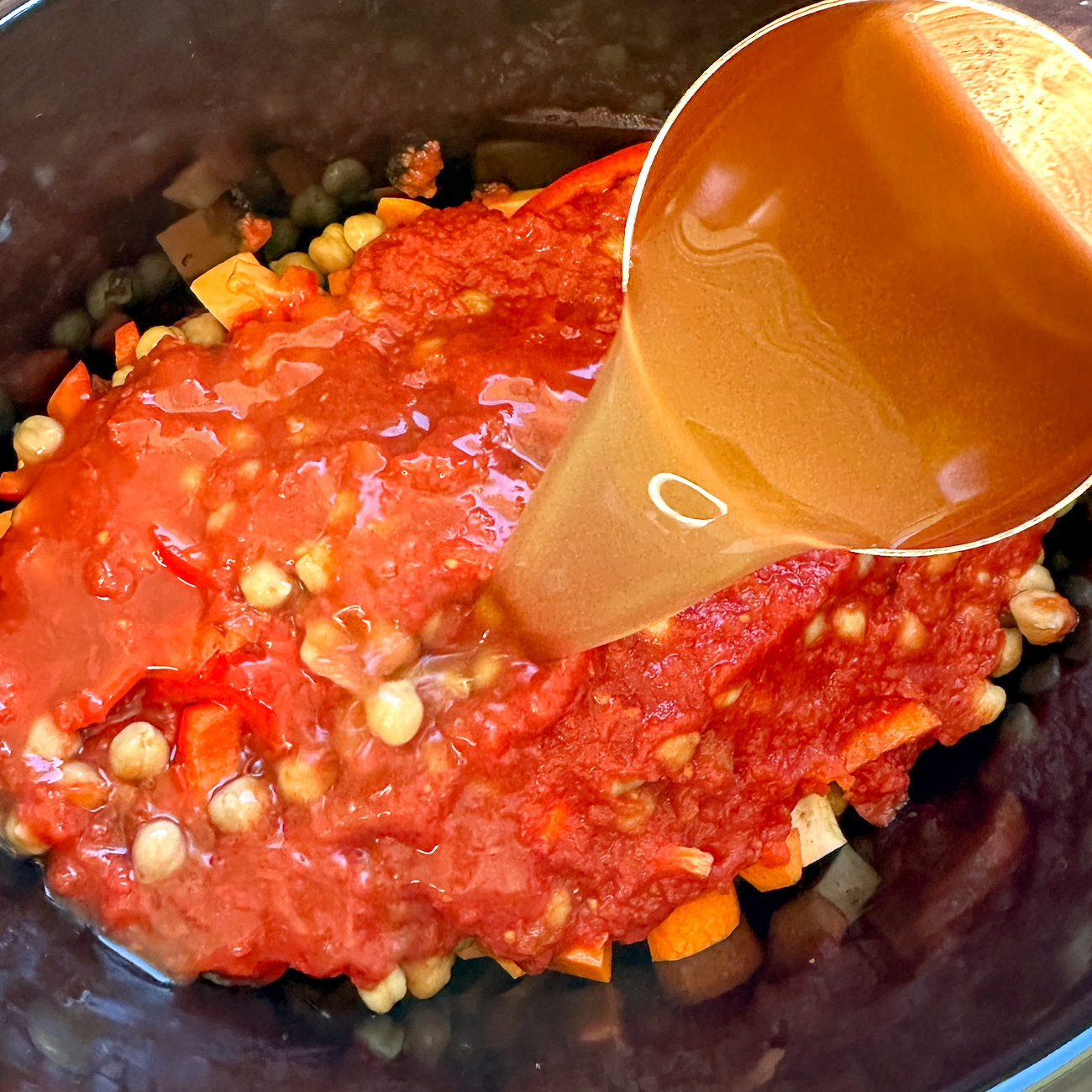 Pour over the tomatos and stock