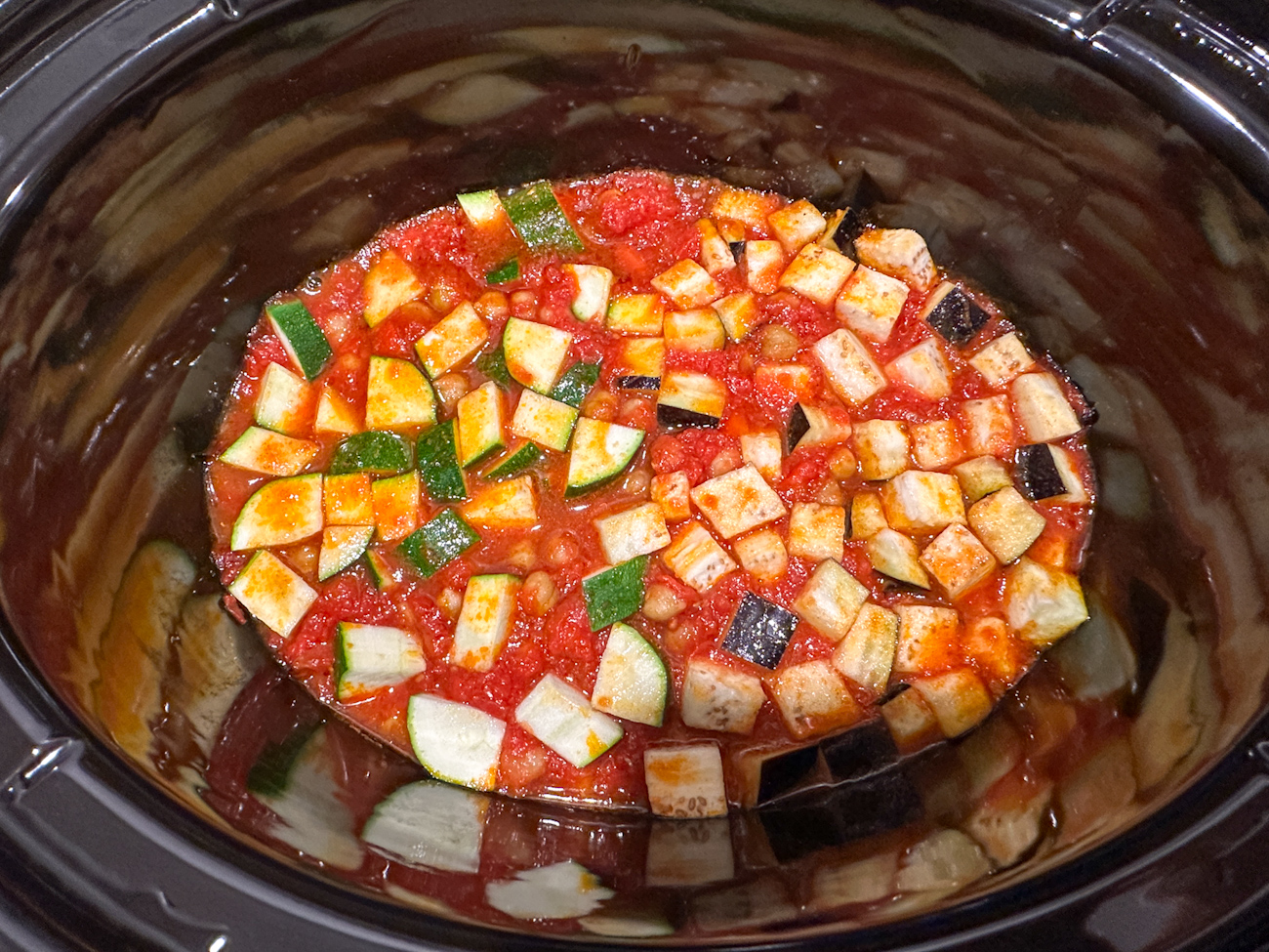 adding the eggplant and zucchini part way through cooking to the slow cooker