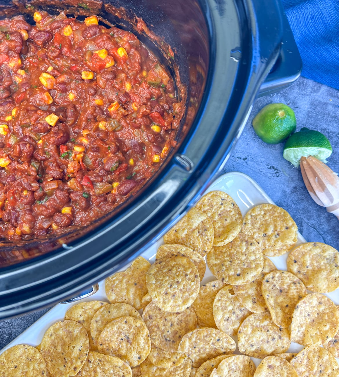 slow cooker full of vegetarian chili and nacho corn chips