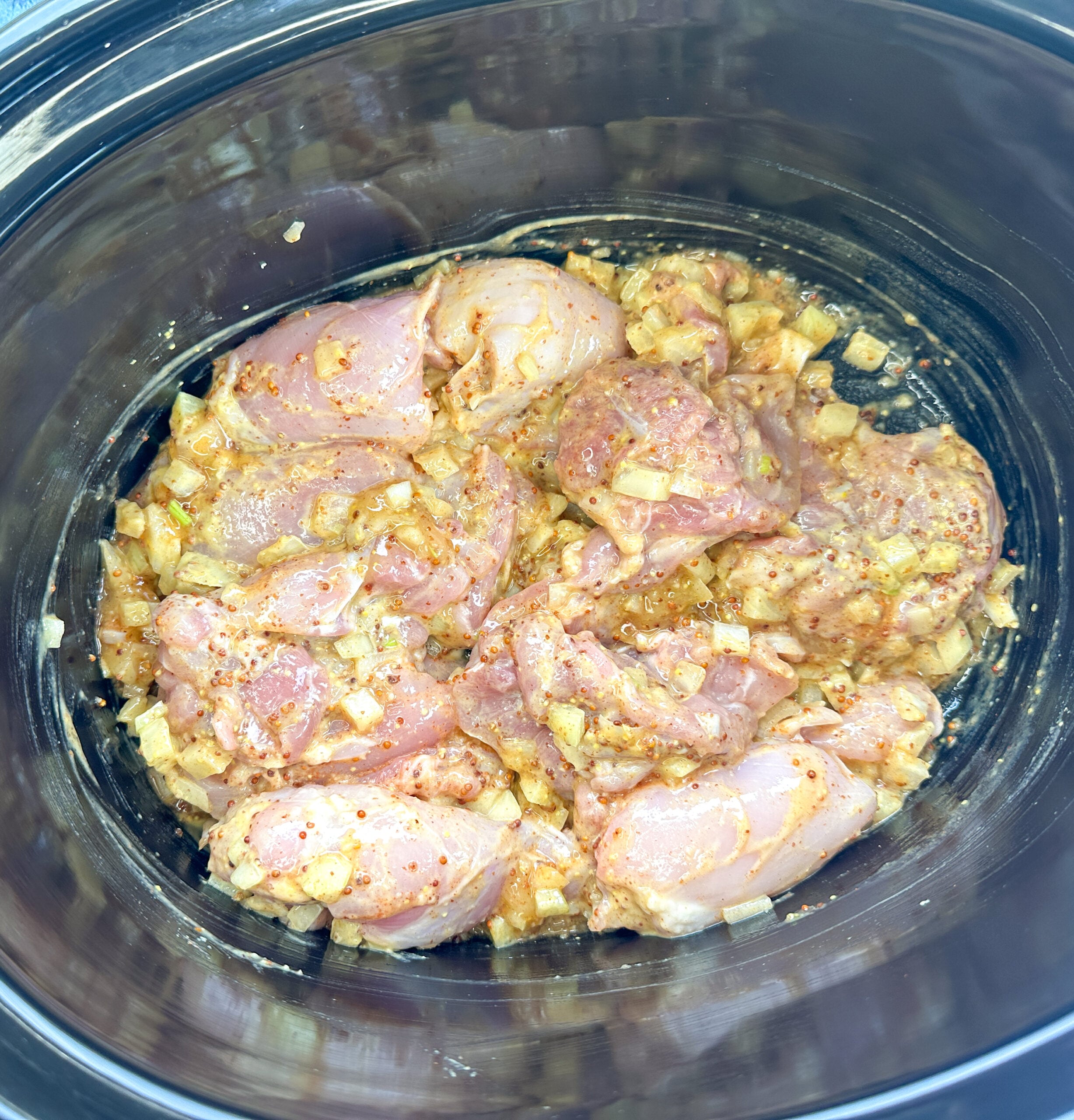 all of the ingredients in the slow cooker for honey mustard chicken