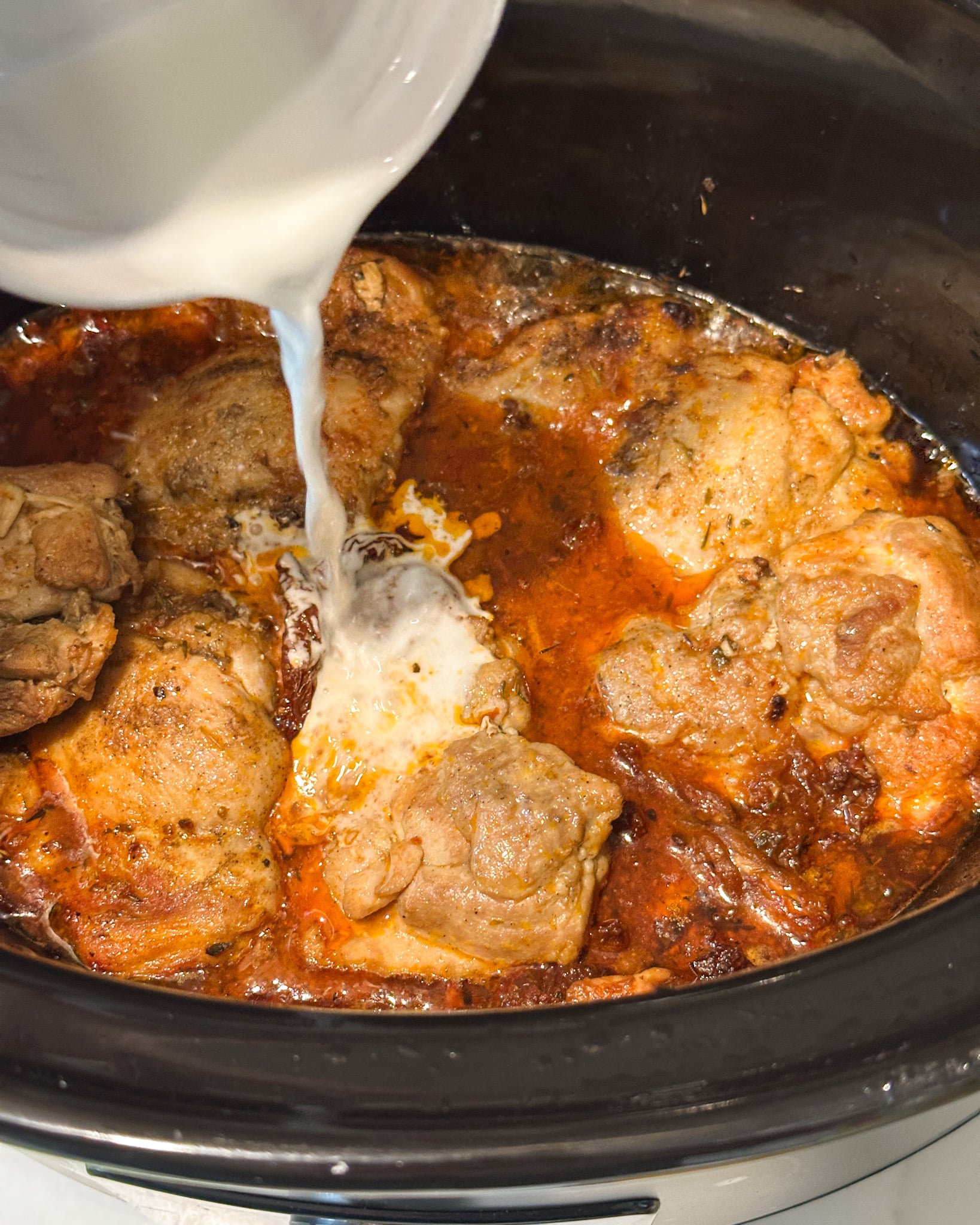 Slow Cooker Creamy Tuscan Chicken Adding cornflour slurry to the chicken to thicken it