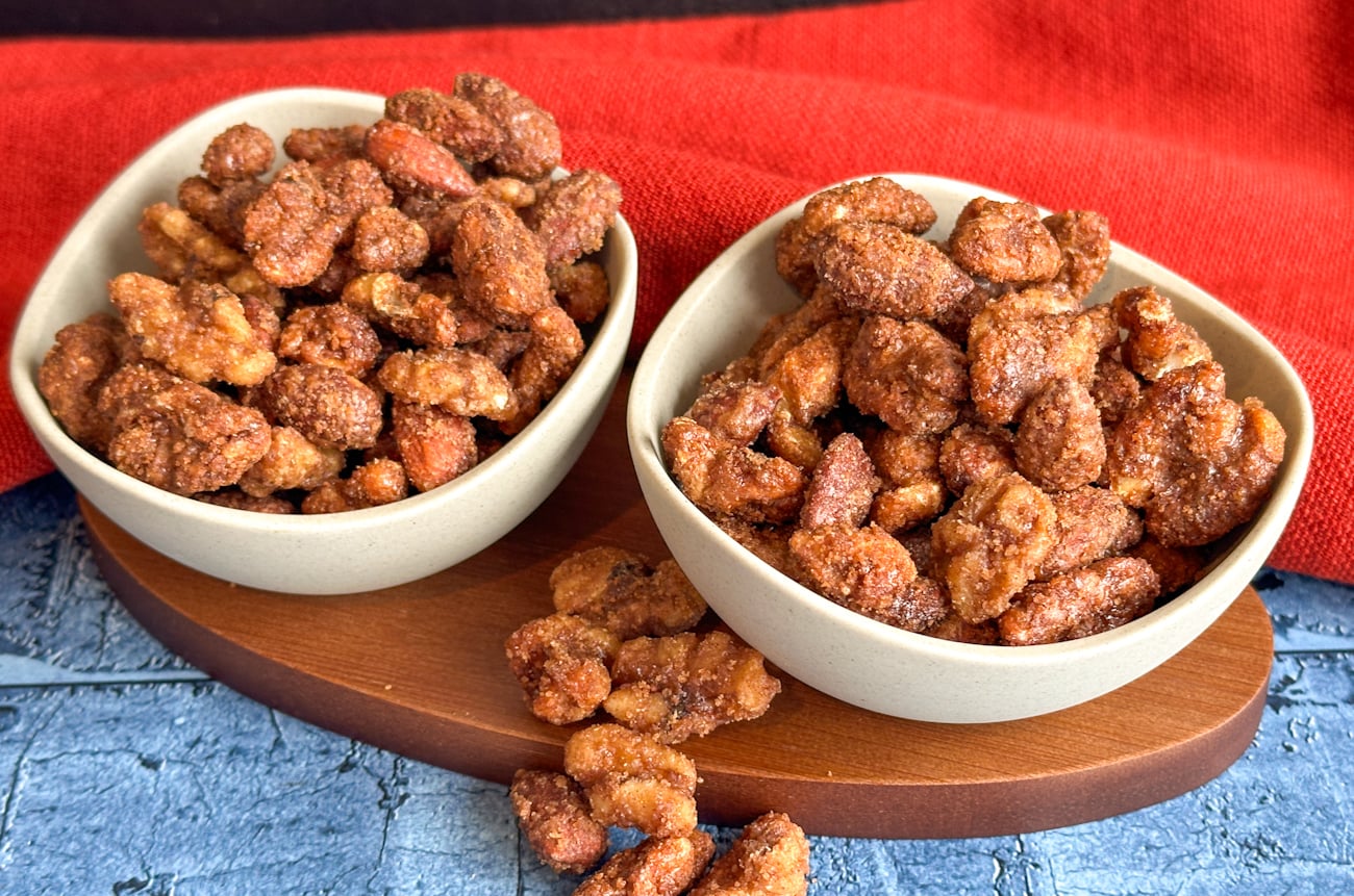 two small serving bowls of candied nuts