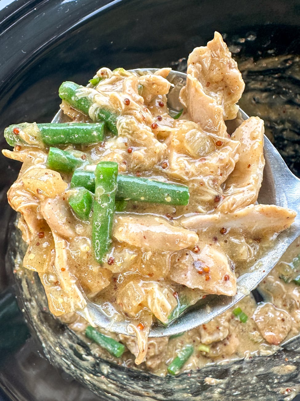 ladle full of honey mustard chicken