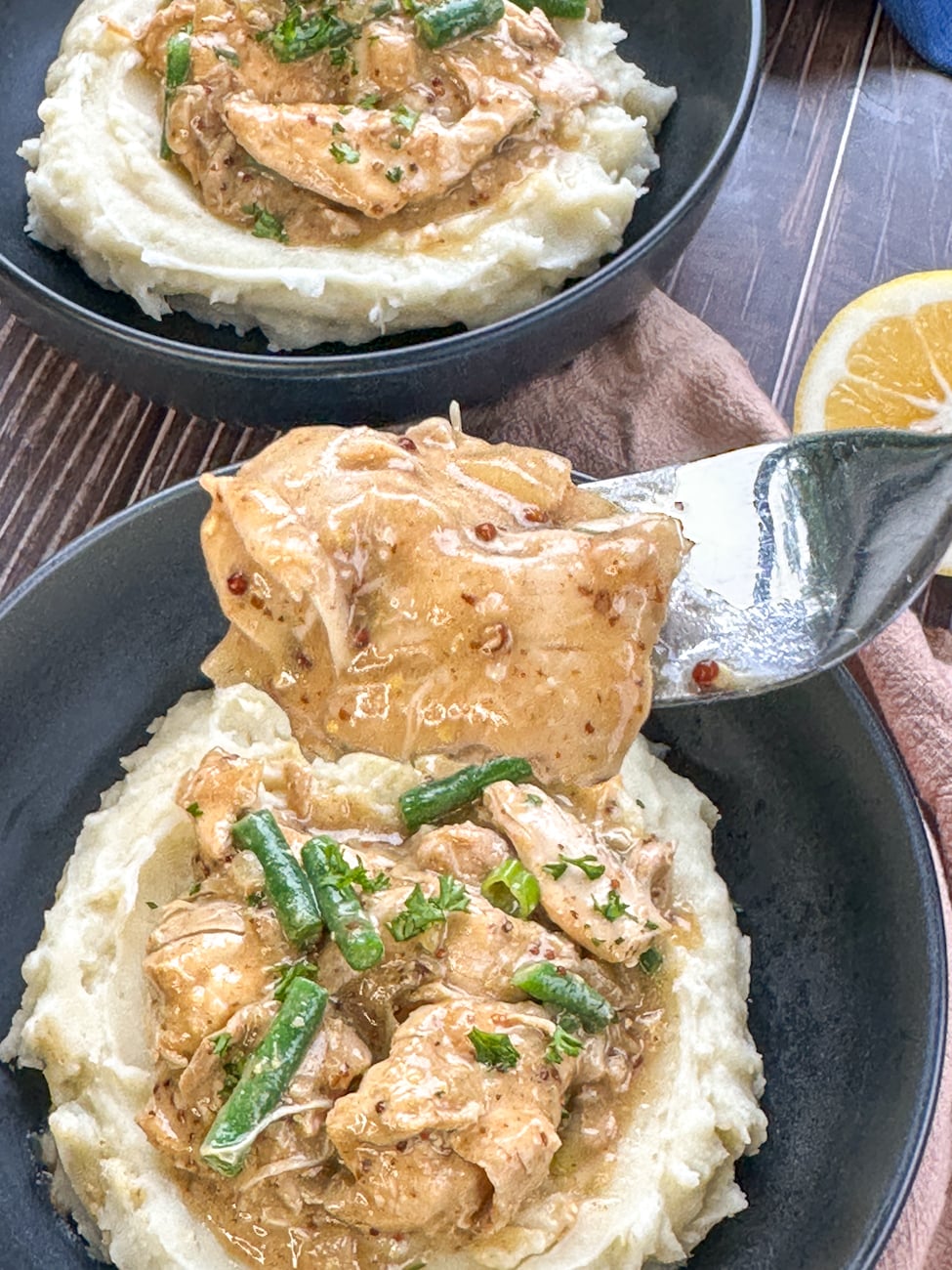 fork with glossy honey mustard chicken