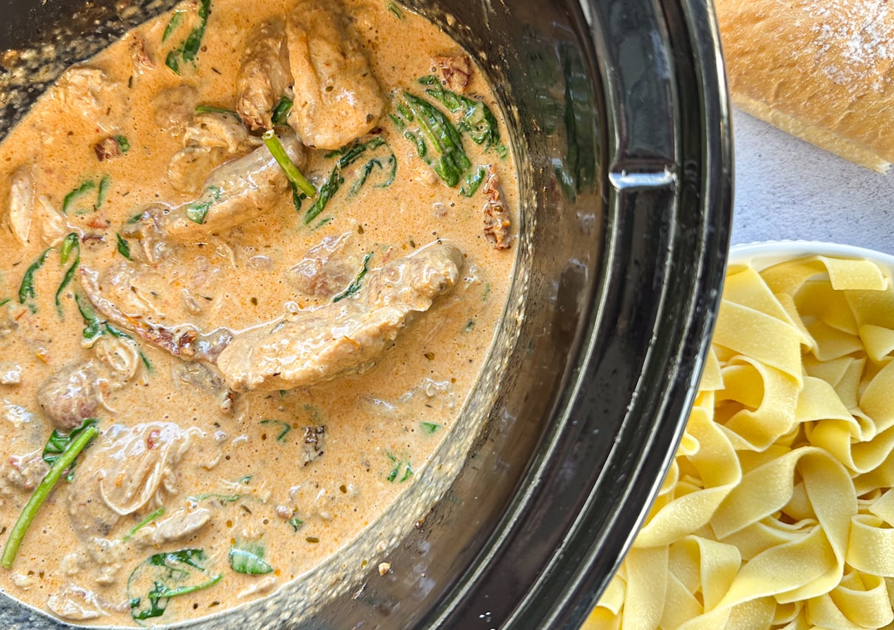 slow cooker with creamy tuscan chicken