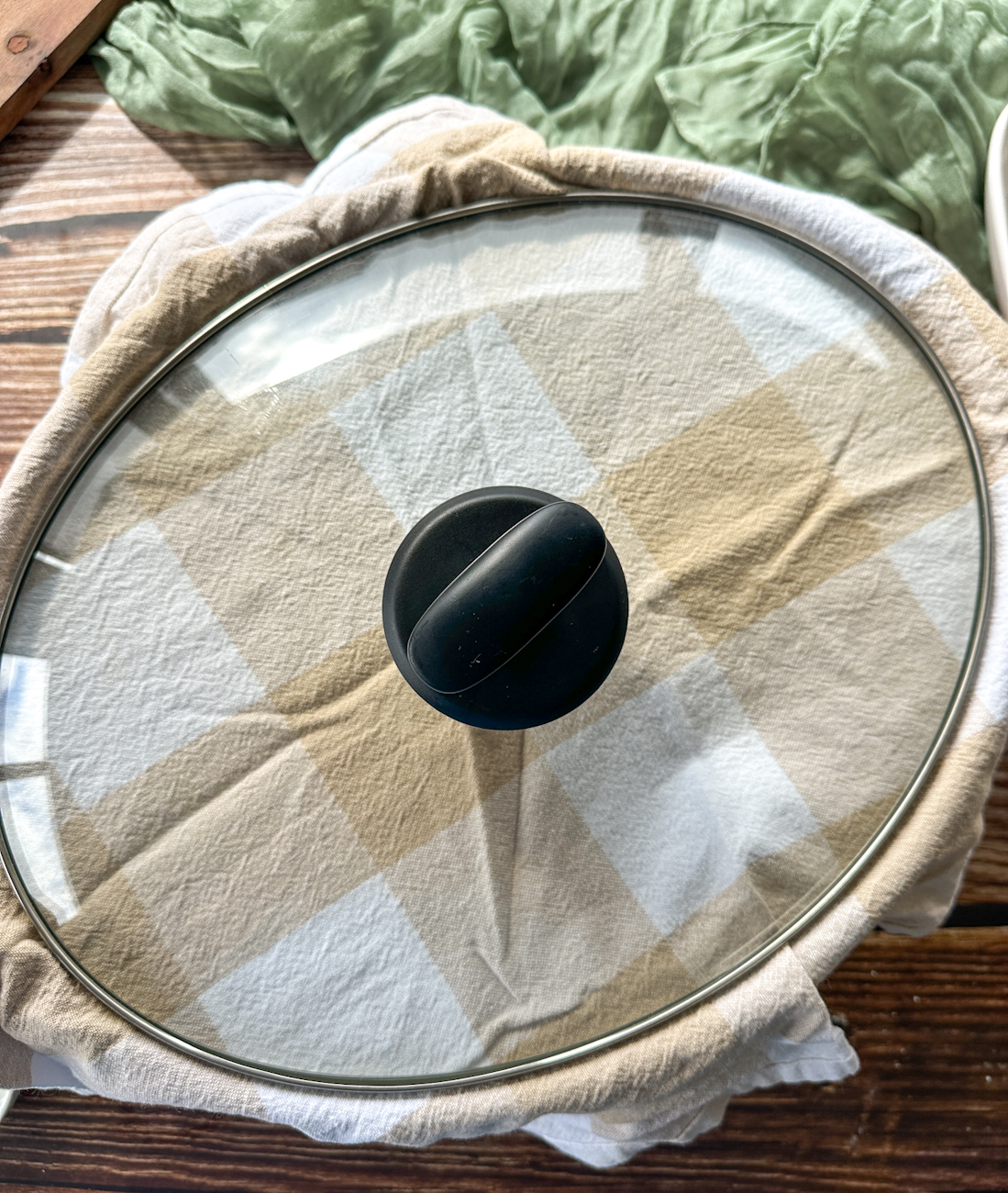 tea towel under the lid of the slow cooker to prevent condensation on the pudding