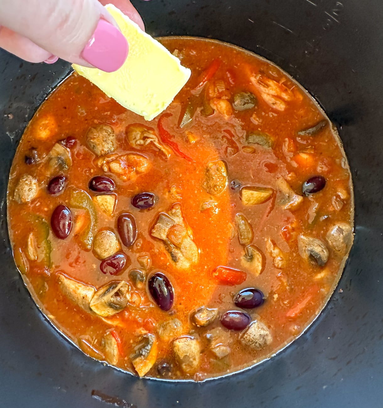 adding butter to the finished dish