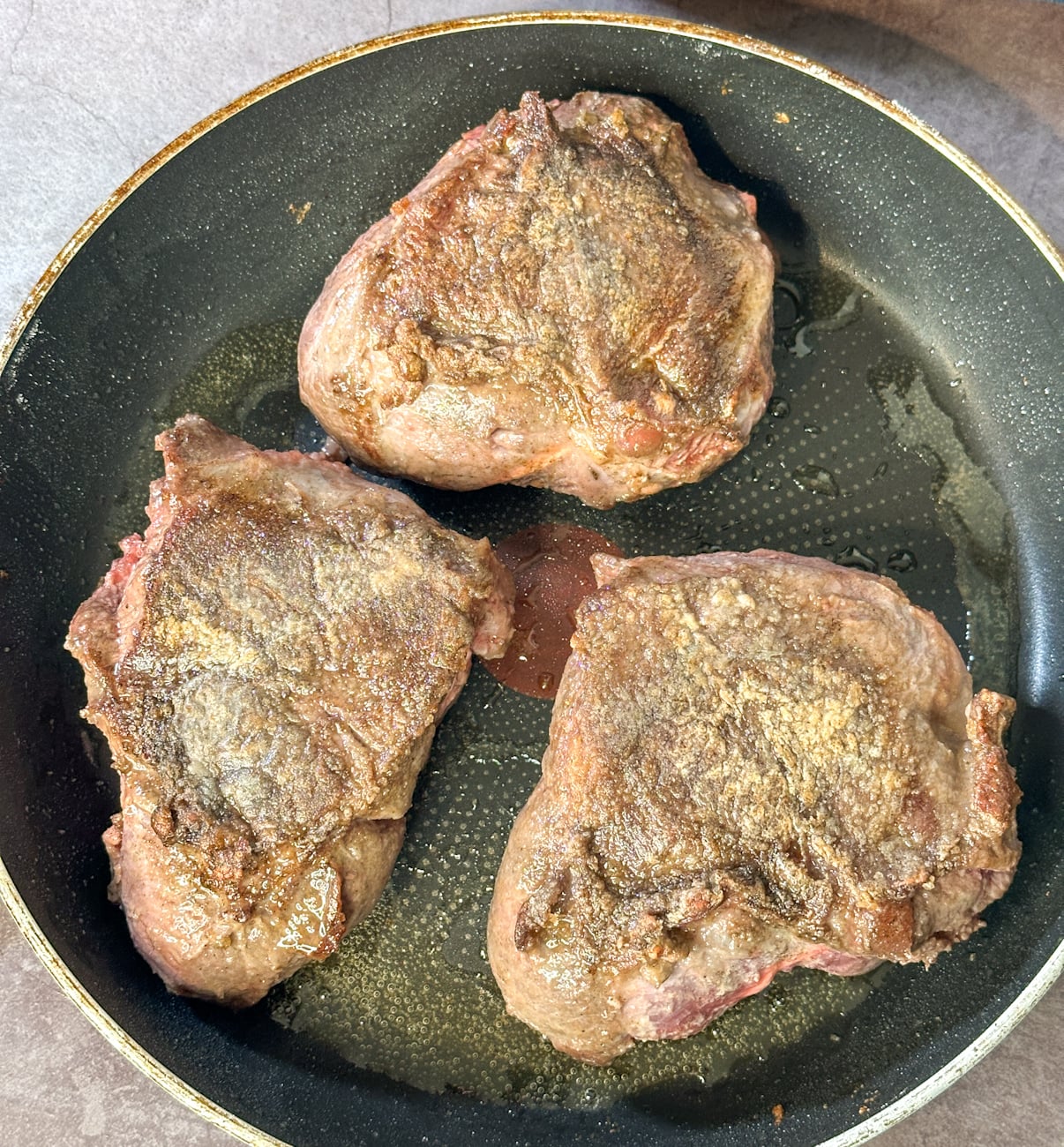 flour and sear the beef cheeks in a frying pan before adding to the slow cooker