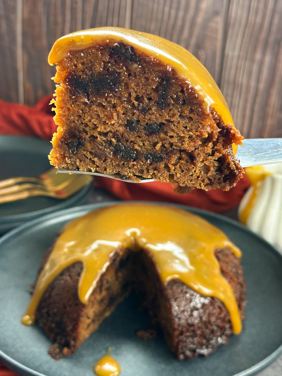slice of sticky date pudding with caramel sauce