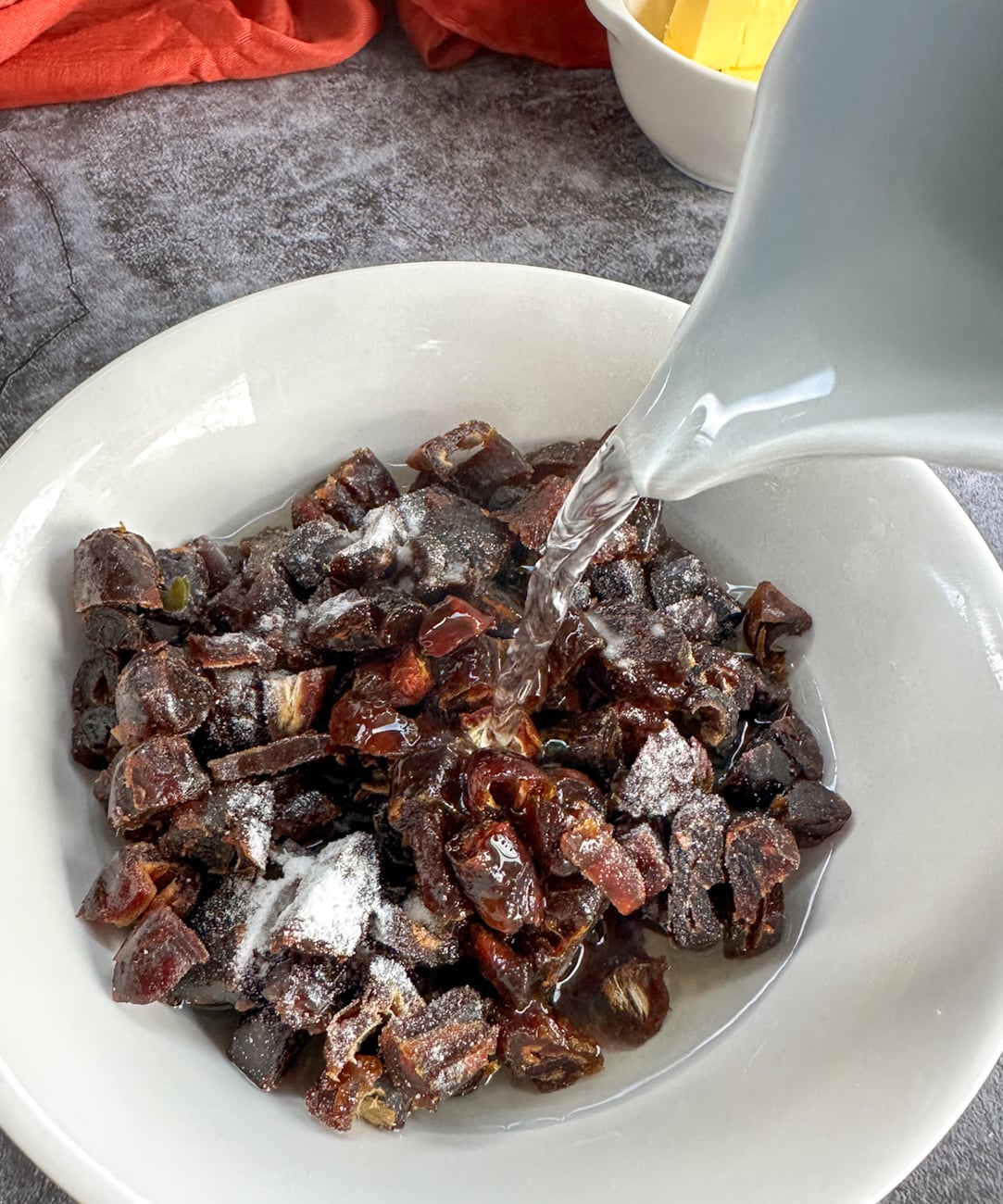 adding boiling water to the dates and baking soda